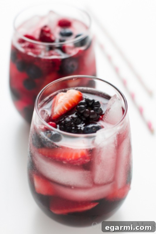 A pitcher of Summer Berry Moscato Sangria with fruit