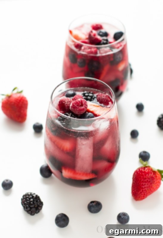 Pouring Summer Berry Moscato Sangria into a glass
