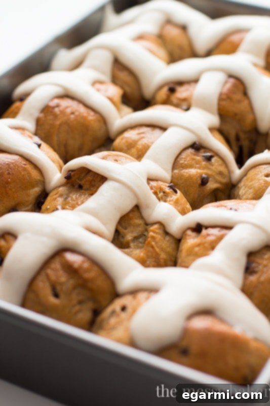 Choc-Chip Hot Cross Buns 5 A pan full of warm Chocolate Chip Hot Cross Buns with icing ready to be served