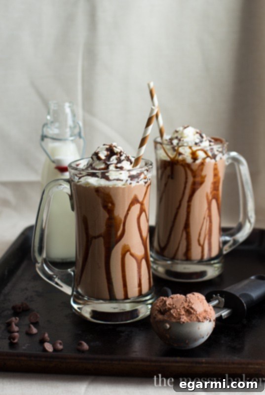 Decadent Roasted Banana Peanut Butter Chocolate Milkshake 2 Decadent Chocolate Peanut Butter Roasted Banana Milkshake with whipped cream and chocolate drizzle