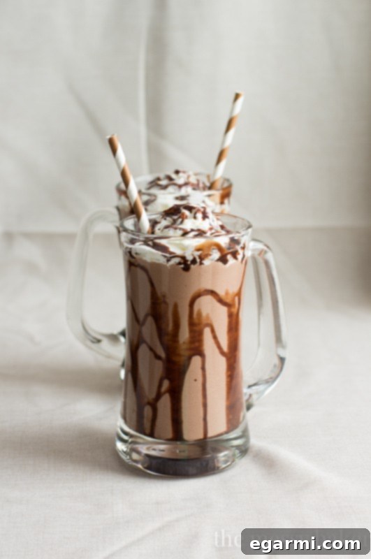 Decadent Roasted Banana Peanut Butter Chocolate Milkshake 3 Rich and creamy Chocolate Peanut Butter Roasted Banana Milkshake in a tall glass