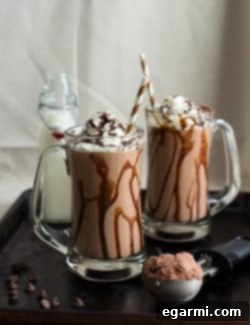 Decadent Roasted Banana Peanut Butter Chocolate Milkshake 6 Finished Chocolate Peanut Butter Roasted Banana Milkshake topped with whipped cream