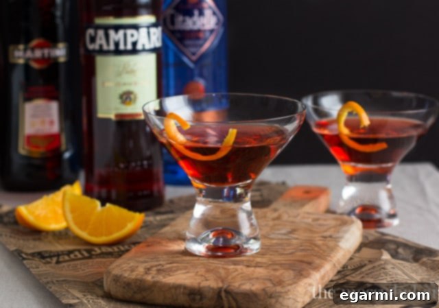 Classic Negroni Cocktail | A Negroni cocktail presented elegantly on a dark surface.