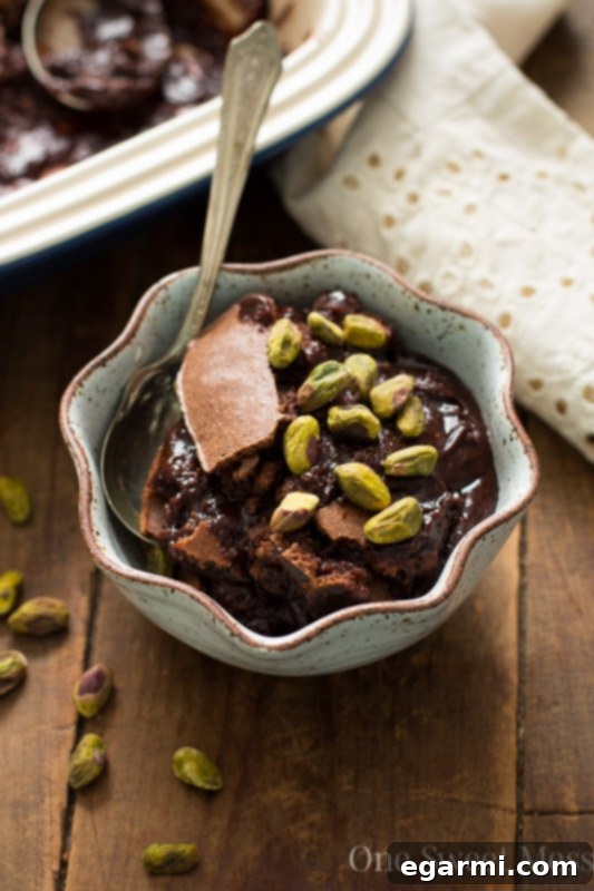 Aromatic Earl Grey Fudge Pudding 7 Earl Grey Brownie Pudding garnished with pistachios and a serving spoon
