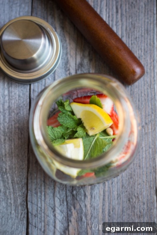 Strawberry Jam Bourbon Smash - Muddling ingredients