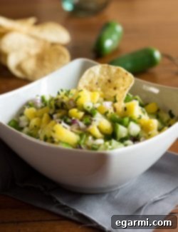 Final presentation of Pineapple Cucumber Salsa with lime slices