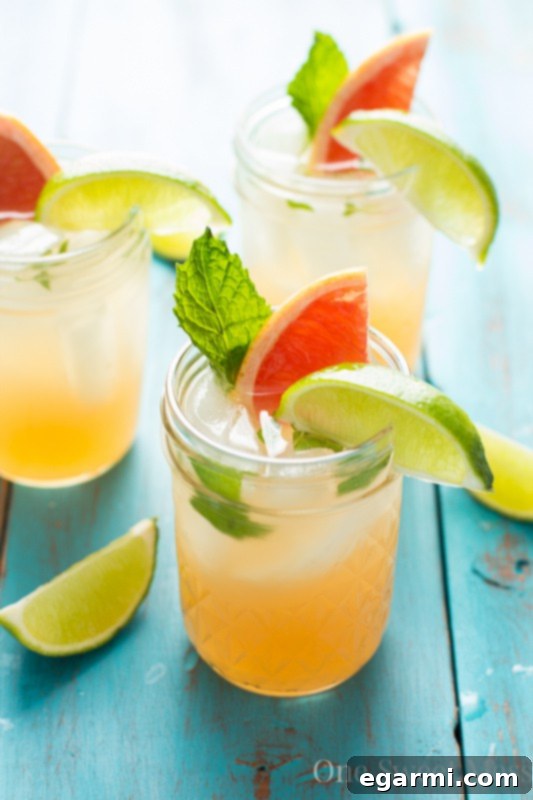 Delicious Grapefruit Honey Mojito cocktail in a glass with fresh mint and grapefruit slices