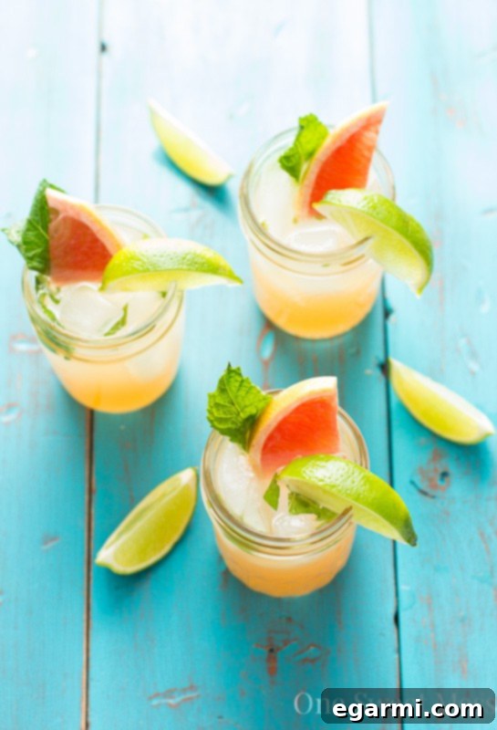Close-up of a refreshing Grapefruit Honey Mojito with mint leaves and ice
