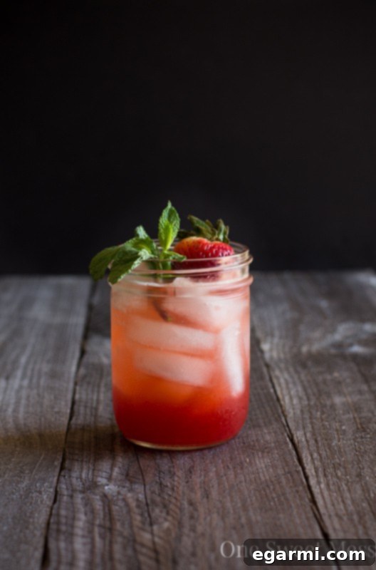 Strawberry Jam Bourbon Smash cocktail in a glass