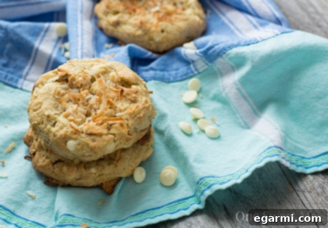 Soft-Baked Lemon Coconut Cookies arranged on a cooling rack, showcasing their uniform shape and toasted coconut topping.