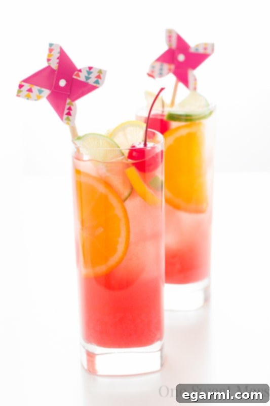 Close-up of a refreshing Tiki Punch with vibrant tropical garnishes, inviting you to take a sip