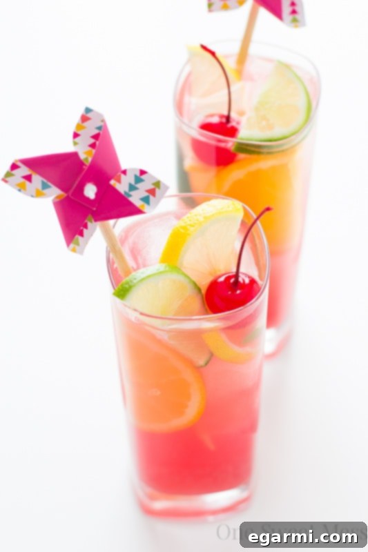 Tropical Tiki Punch being poured into glasses, suggesting a party is about to begin with this delicious drink