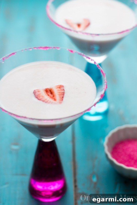 Strawberry Shortcake Martini for Thirsty Thursdays 2 Delicious Strawberry Shortcake Martini served in an elegant glass with a strawberry garnish