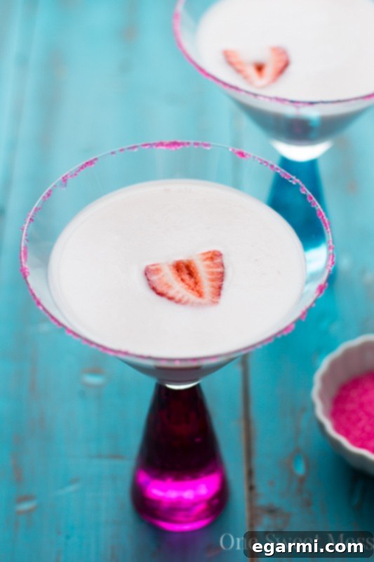 Strawberry Shortcake Martini for Thirsty Thursdays 5 Close-up of a Strawberry Shortcake Martini glass with a beautiful pink sugar rim
