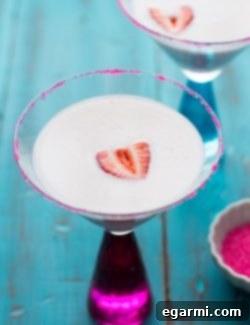 Strawberry Shortcake Martini for Thirsty Thursdays 6 Final Strawberry Shortcake Martini with a strawberry garnish and pink sugar rim