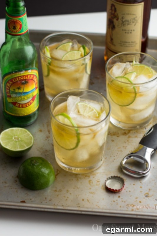 Refreshing Dark & Stormy Cocktail served in a tall glass with lime wedge