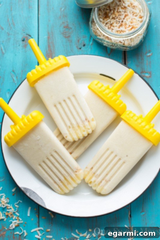 Healthy Vegan Piña Colada Popsicles - Made with coconut cream and frozen bananas