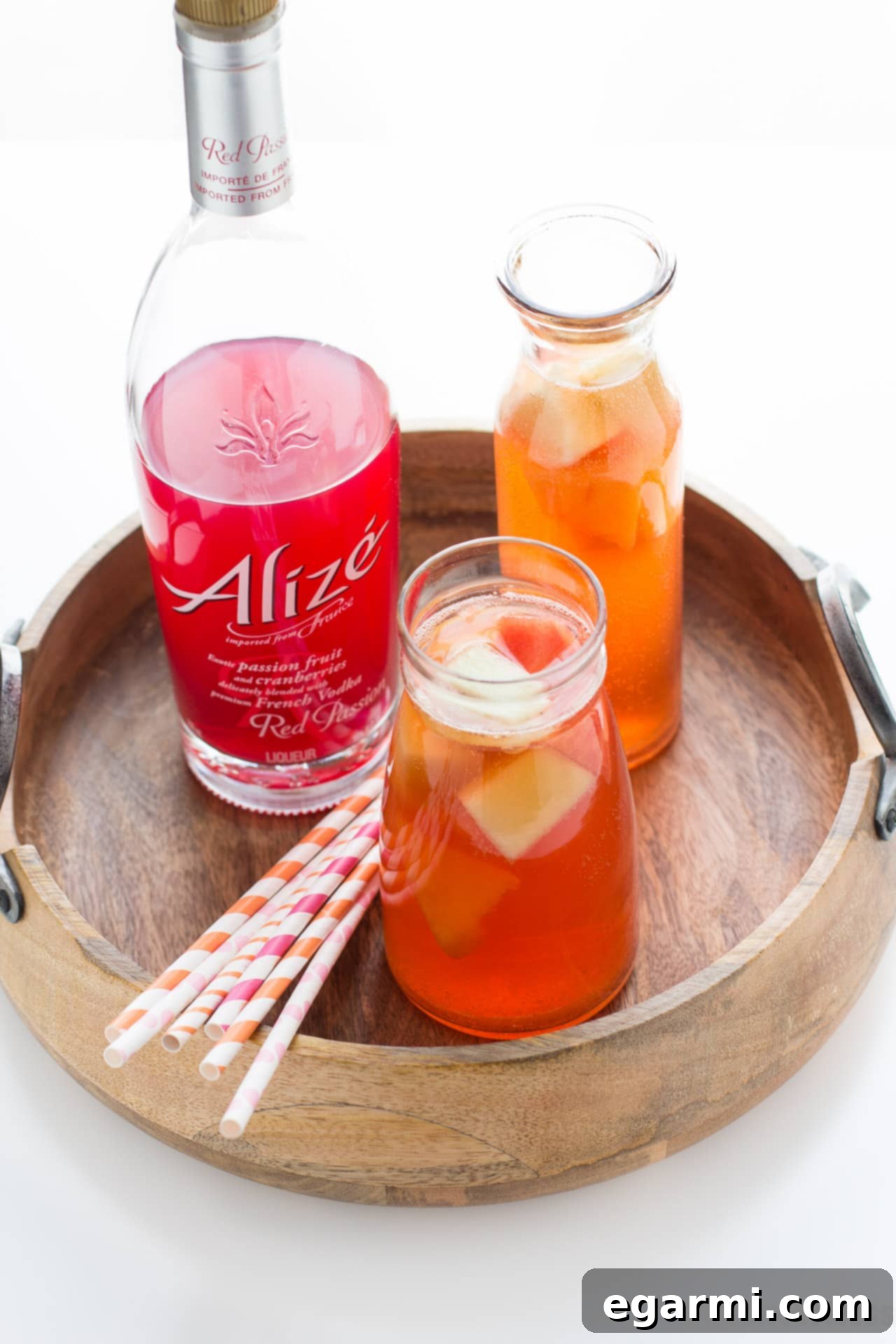 Summer Melon Sangria in a pitcher with sliced fruit