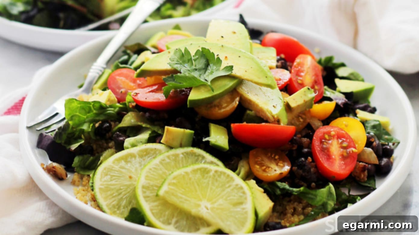 Healthy and vibrant Quinoa Burrito Bowls brimming with fresh vegetables and creamy avocado, perfect for a light yet filling meal.