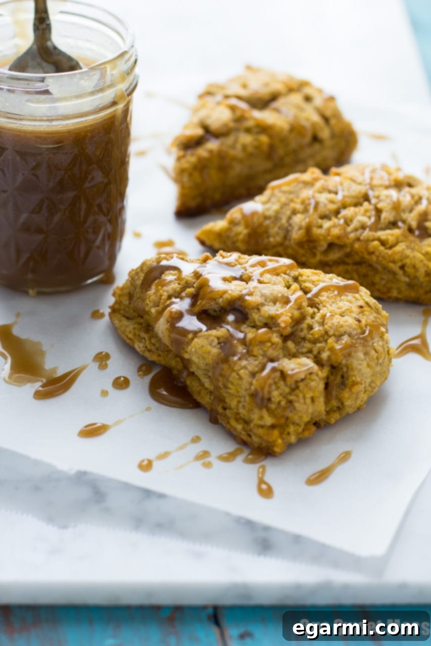 Stack of Pumpkin Spice Scones with Bourbon Caramel Glaze, ready to be enjoyed.