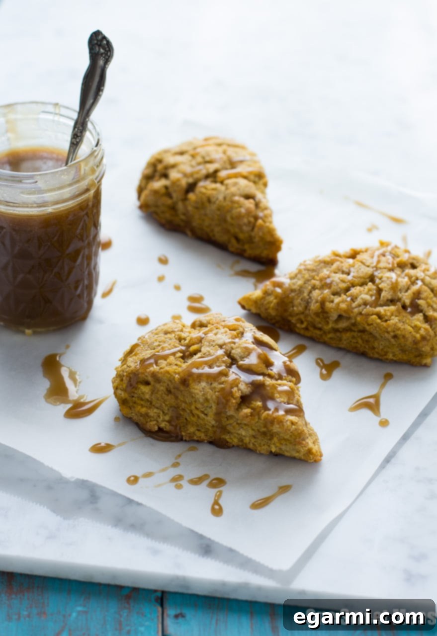 A Pumpkin Spice Scone with Bourbon Caramel Glaze, perfectly golden brown.