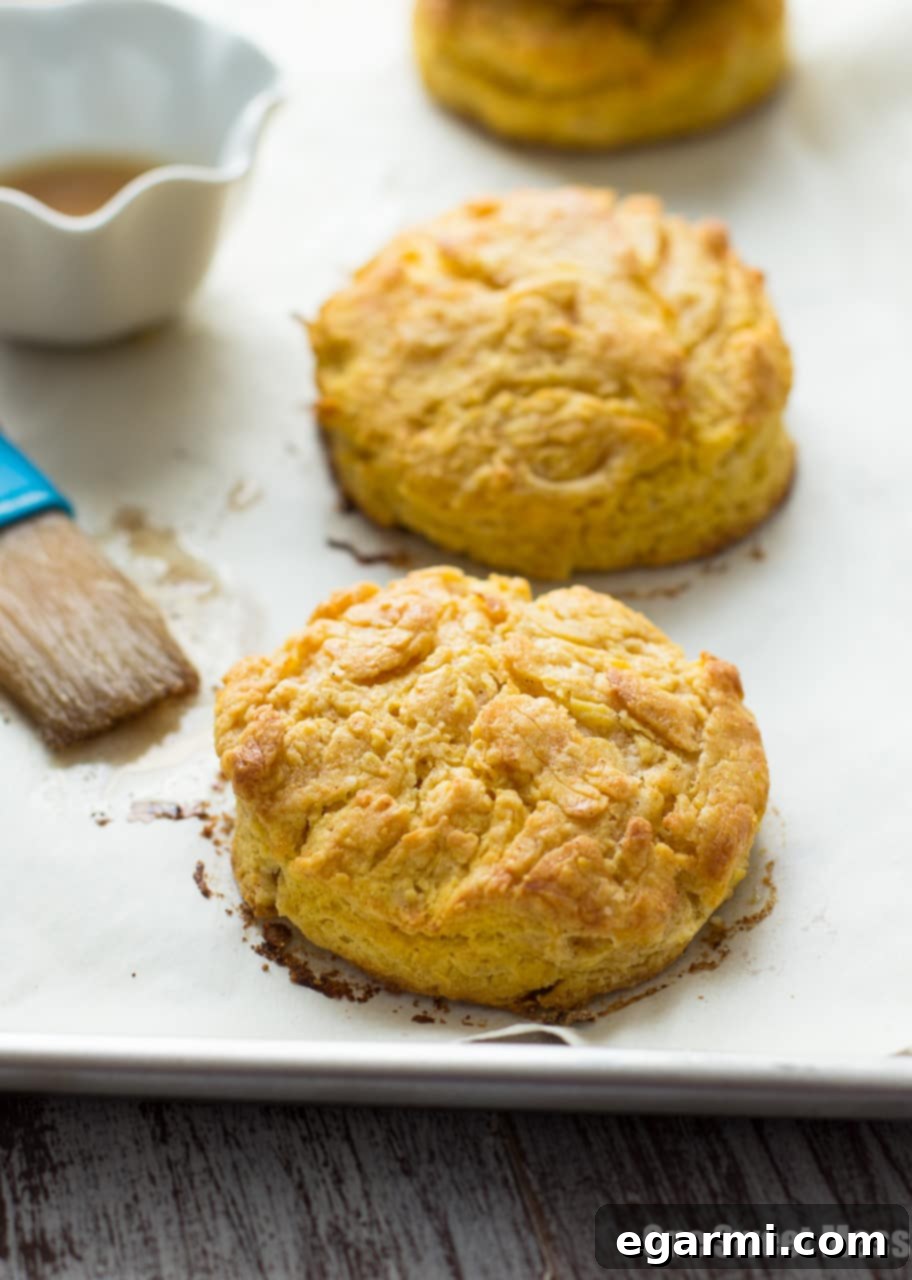 Several pumpkin biscuits arranged on a rustic wooden board, ready to be served