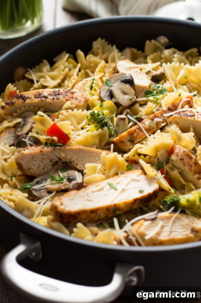 Hearty Chicken Alfredo Primavera, showcasing the rich Alfredo sauce, tender chicken, and vibrant vegetables, a quick 30-minute dinner solution.