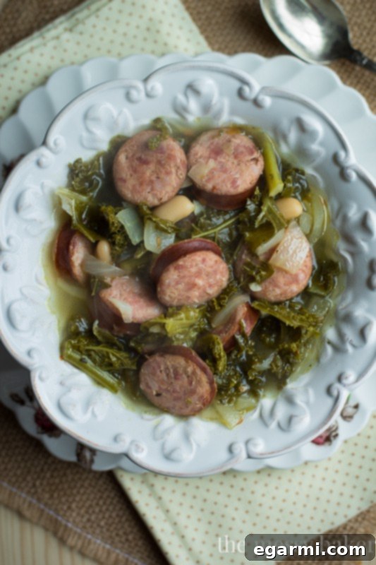 Slow Cooker Kielbasa Soup with Kale and White Beans | www.themessybakerblog.com