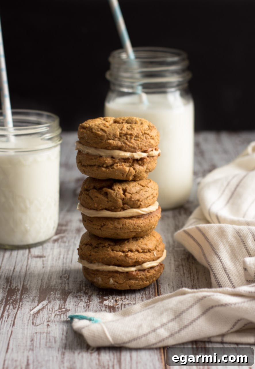 Delicious Pumpkin Cookie Butter Ginger Sandwich Cookies stacked on a plate