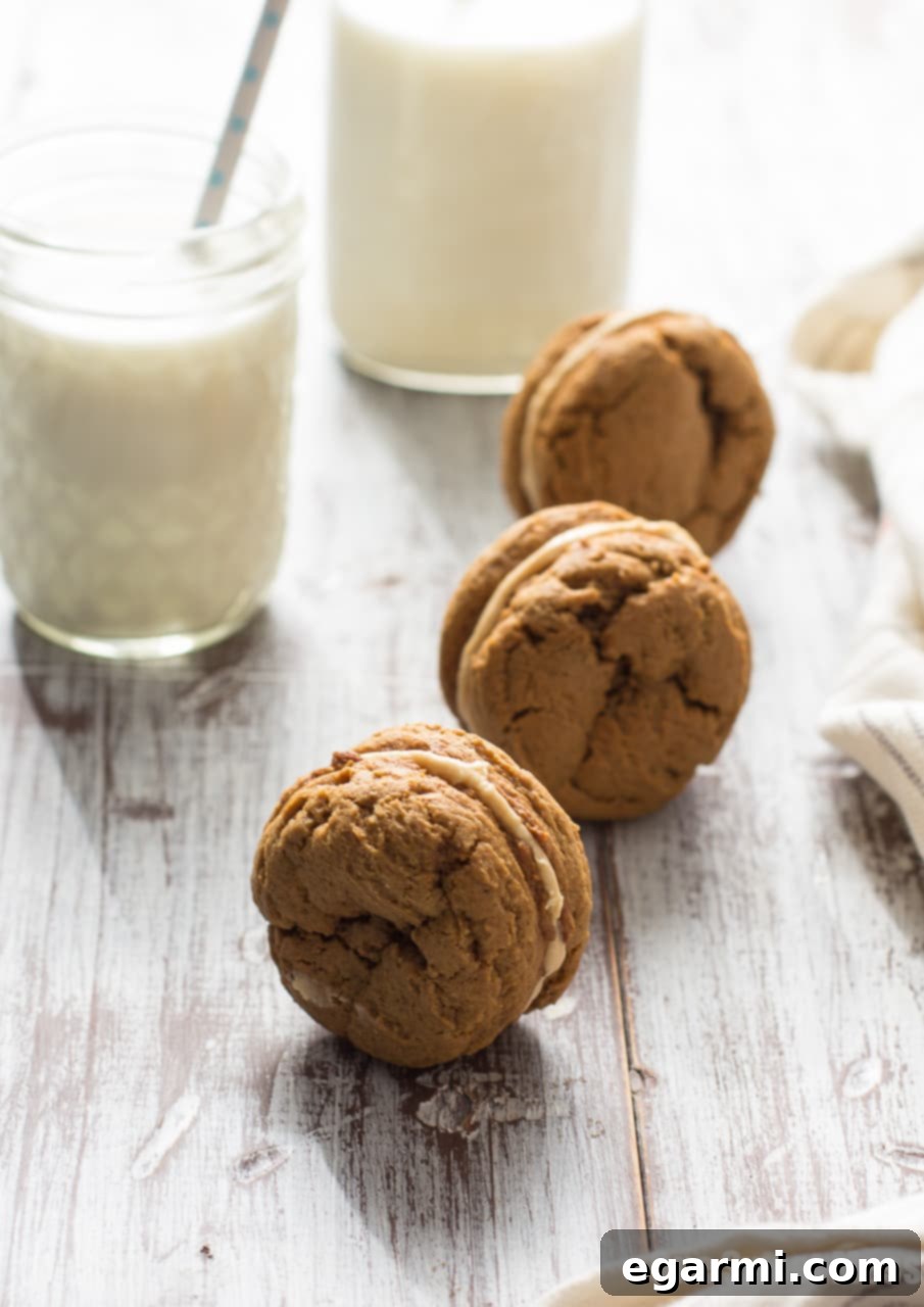 A stack of three Pumpkin Cookie Butter Ginger Sandwich Cookies