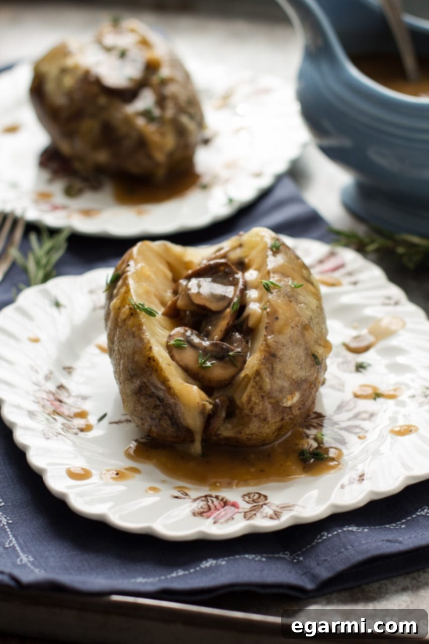 Fluffy Baked Potato with Savory Mushroom Gravy and Melted Swiss Cheese