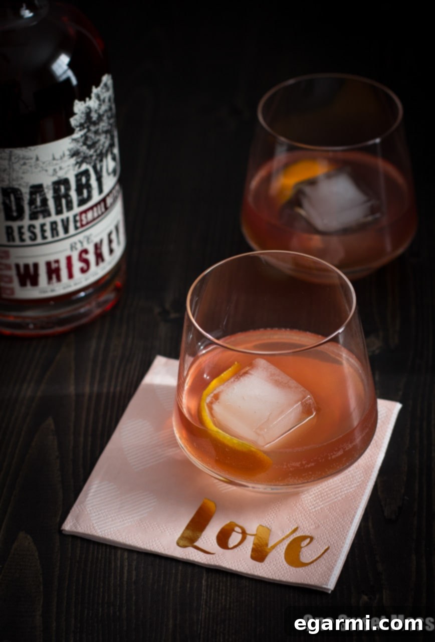 Whispers of a Waltz 2 The Tiny Dancer Cocktail: This fierce but delicate cocktail combines bourbon, Campari, and blood orange juice.