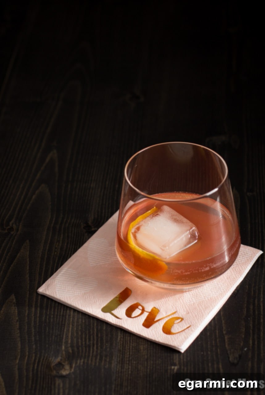 Whispers of a Waltz 4 The Tiny Dancer Cocktail: This fierce but delicate cocktail combines bourbon, Campari, and blood orange juice.